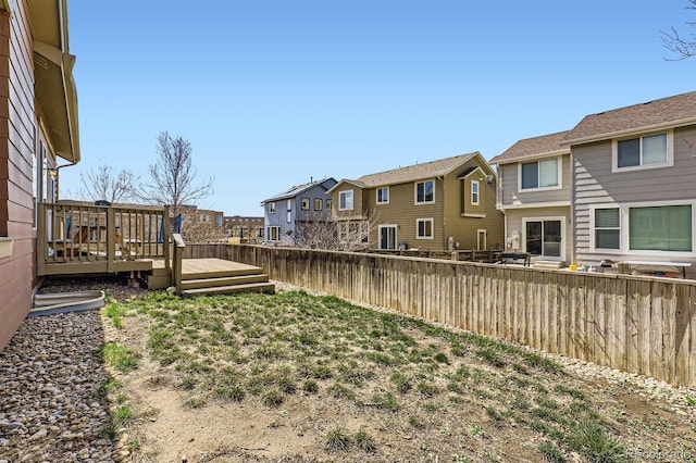 10117 Waco St, Commerce City, CO 80022 - fenced yard featuring a residential view and a wooden deck