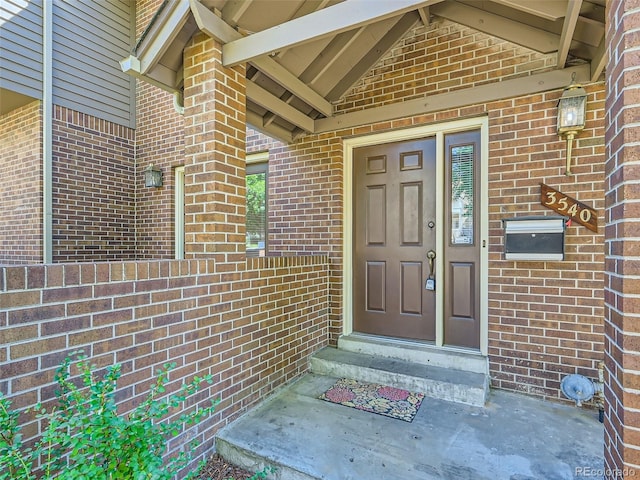 3540 E 5th Ave, Denver, CO 80206 - view of exterior entry with brick siding and fence