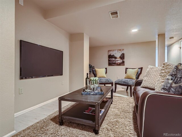 3540 E 5th Ave, Denver, CO 80206 - living room with baseboards, wood finished floors, and recessed lighting