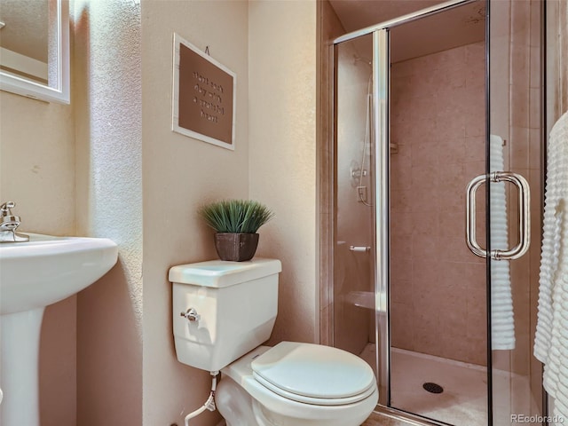 3540 E 5th Ave, Denver, CO 80206 - full bathroom with a stall shower, toilet, and a sink