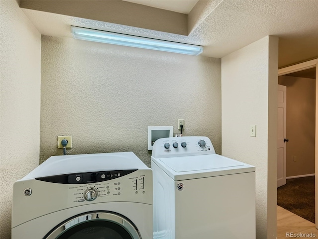 3540 E 5th Ave, Denver, CO 80206 - clothes washing area with washing machine and dryer and a textured wall