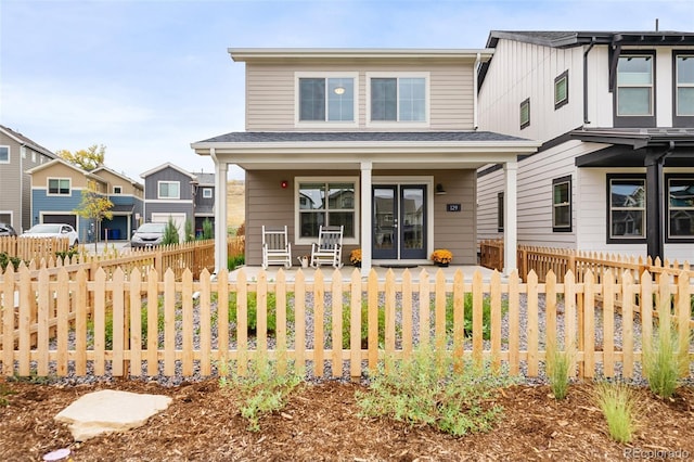 view of front of house with a porch and a fenced front yard