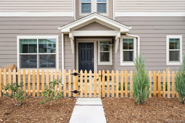 view of exterior entry with fence