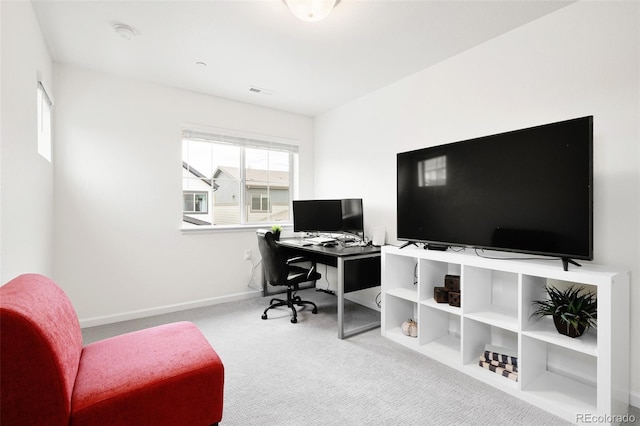 office area featuring baseboards, visible vents, and carpet