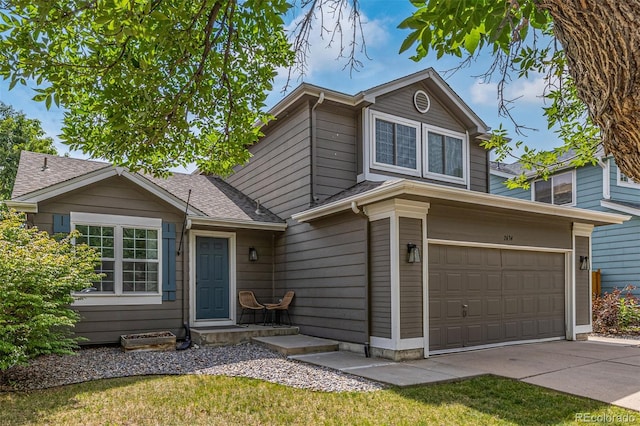 2634 E 132nd Ave, Thornton, CO 80241 - view of front of property featuring driveway, a garage, and a shingled roof