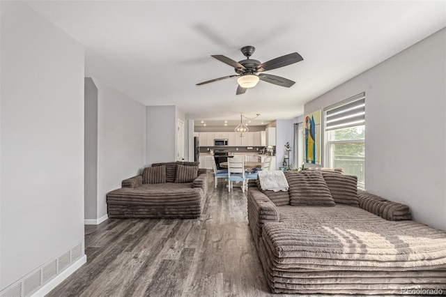 2634 E 132nd Ave, Thornton, CO 80241 - living room with dark wood-style flooring and ceiling fan