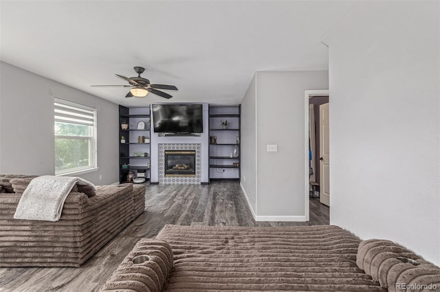 2634 E 132nd Ave, Thornton, CO 80241 - living area featuring wood finished floors, ceiling fan, and a fireplace