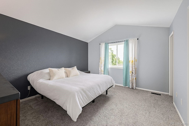 2634 E 132nd Ave, Thornton, CO 80241 - carpeted bedroom featuring lofted ceiling and baseboards