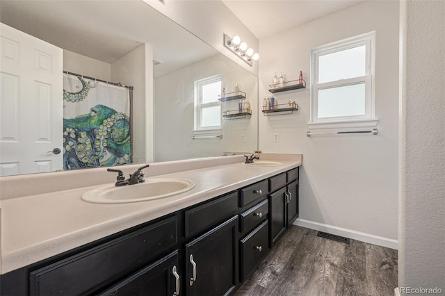 2634 E 132nd Ave, Thornton, CO 80241 - bathroom with wood finished floors and double vanity