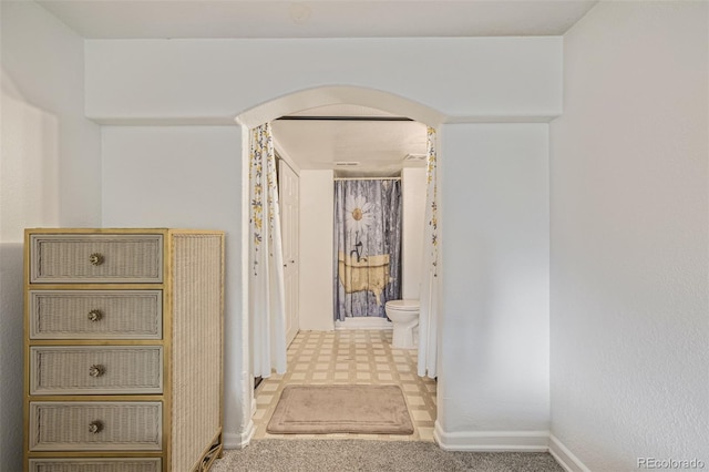 2634 E 132nd Ave, Thornton, CO 80241 - corridor with arched walkways and tile patterned floors