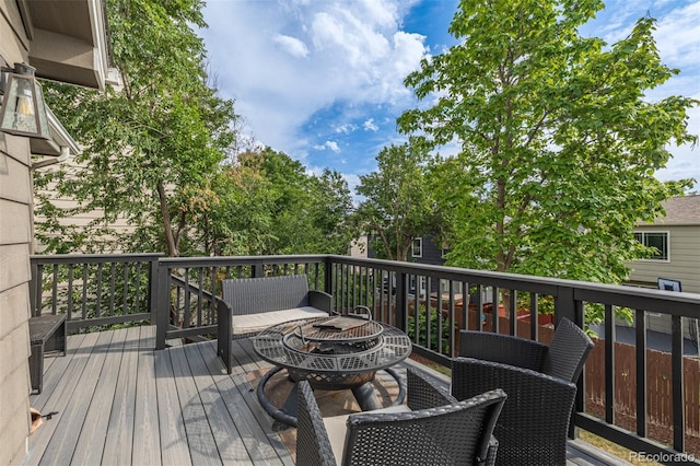 2634 E 132nd Ave, Thornton, CO 80241 - wooden terrace with a fire pit