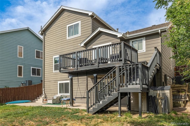 2634 E 132nd Ave, Thornton, CO 80241 - rear view of property featuring stairs, a patio, and a deck