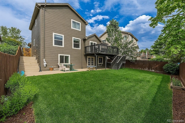 2634 E 132nd Ave, Thornton, CO 80241 - back of house featuring stairway, a fenced backyard, a deck, and a patio area