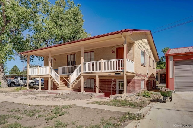 1291 W 3rd Ave, Broomfield, CO 80020 - view of front facade with a porch, stairway, and brick siding