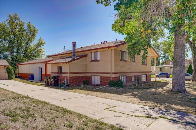 1291 W 3rd Ave, Broomfield, CO 80020 - view of front facade featuring brick siding