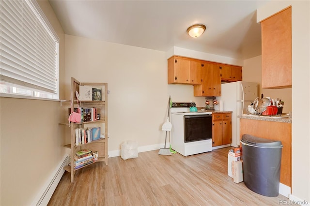 1291 W 3rd Ave, Broomfield, CO 80020 - kitchen with light wood-type flooring, light countertops, baseboards, a baseboard heating unit, and white appliances