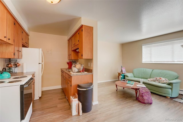 1291 W 3rd Ave, Broomfield, CO 80020 - kitchen featuring light wood finished floors, light countertops, white range with electric cooktop, open floor plan, and baseboards