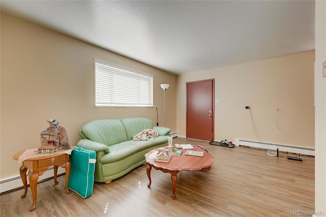 1291 W 3rd Ave, Broomfield, CO 80020 - living area with baseboards, a baseboard heating unit, and light wood finished floors
