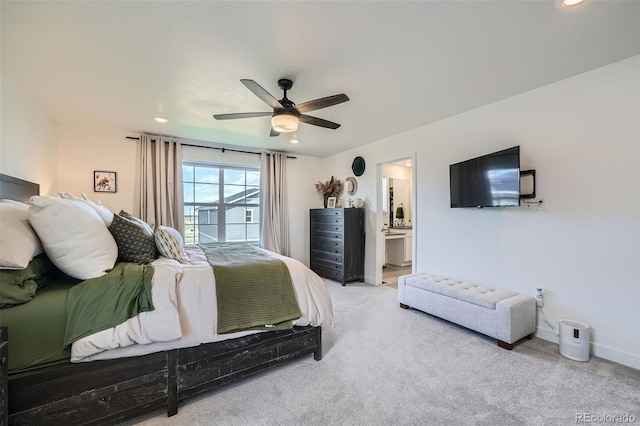 carpeted bedroom with ensuite bath, a ceiling fan, and recessed lighting