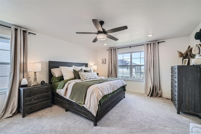 bedroom featuring light colored carpet, baseboards, a ceiling fan, and recessed lighting