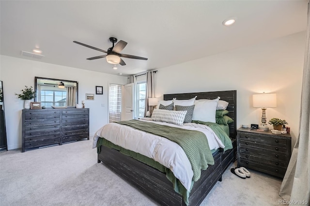 carpeted bedroom featuring visible vents, a ceiling fan, and recessed lighting