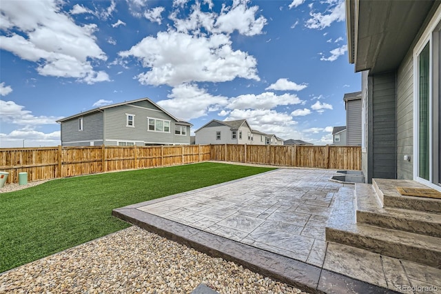 view of yard featuring a fenced backyard and a patio area