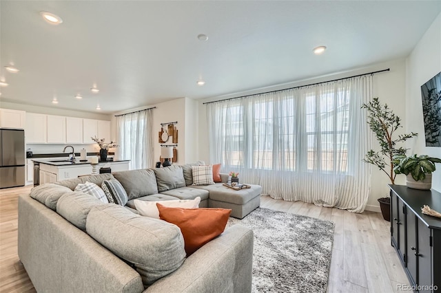 living room featuring light wood-style floors and recessed lighting