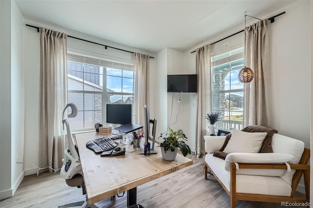 4875 E 148th Pl, Thornton, CO 80602 - home office with plenty of natural light and light wood-style floors
