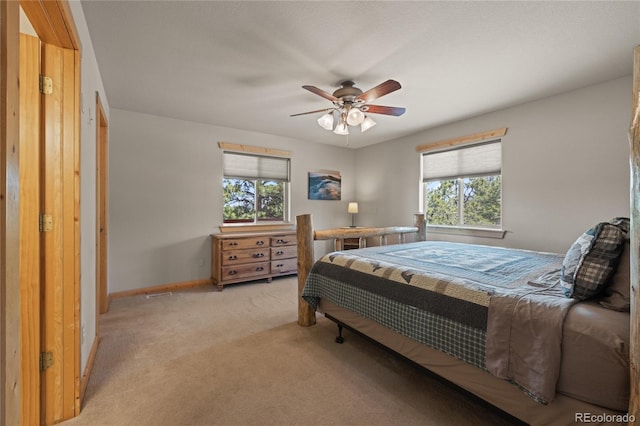 1948 Wagon Wheel Rd, Hartsel, CO 80449 - bedroom with multiple windows, light colored carpet, and a ceiling fan