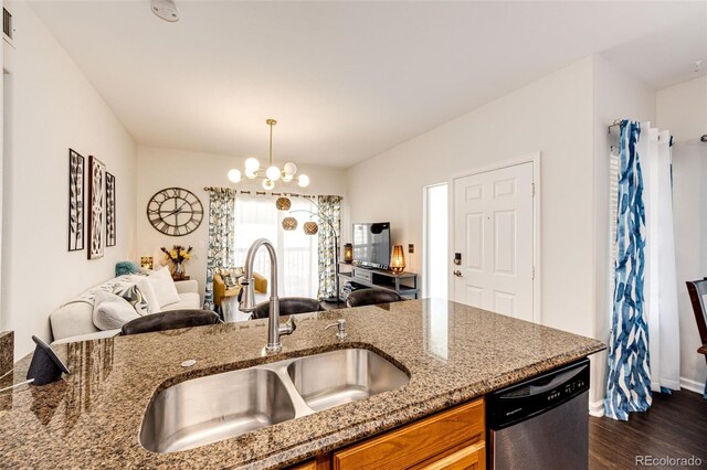 5439 S Dover St Unit 101, Littleton, CO 80123 - kitchen with stainless steel dishwasher, brown cabinetry, dark wood-type flooring, stone countertops, and open floor plan