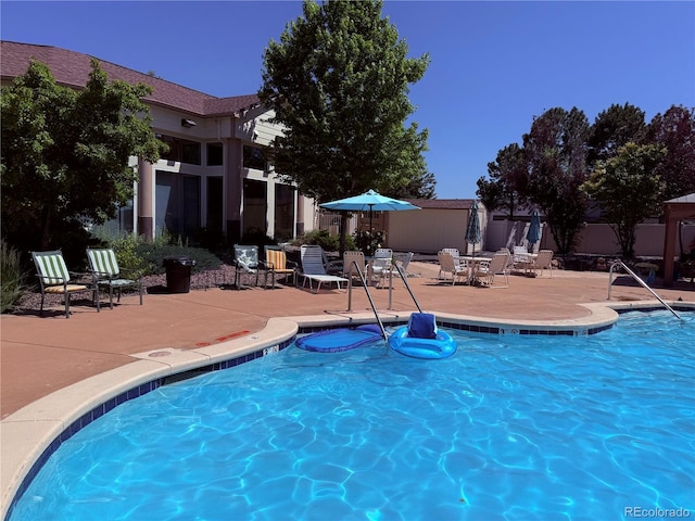 5439 S Dover St Unit 101, Littleton, CO 80123 - community pool featuring a patio area