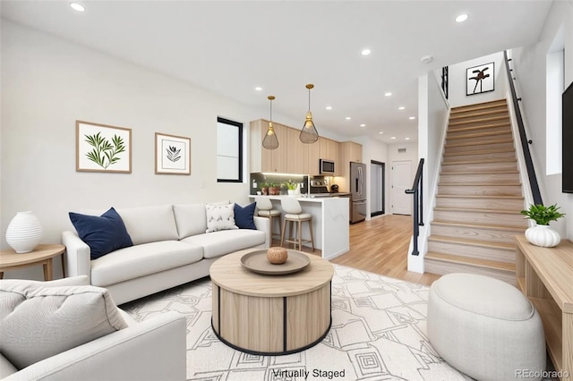 1735 Lowell Blvd, Denver, CO 80204 - living room with recessed lighting, stairway, and light wood-type flooring