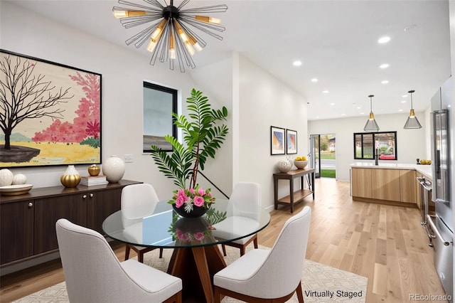 1735 Lowell Blvd, Denver, CO 80204 - dining space with light wood-style floors, recessed lighting, and a notable chandelier