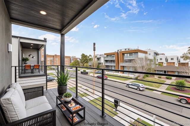 1735 Lowell Blvd, Denver, CO 80204 - balcony featuring outdoor lounge area and a residential view