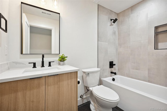 1735 Lowell Blvd, Denver, CO 80204 - full bath featuring vanity, shower / bathing tub combination, toilet, and visible vents