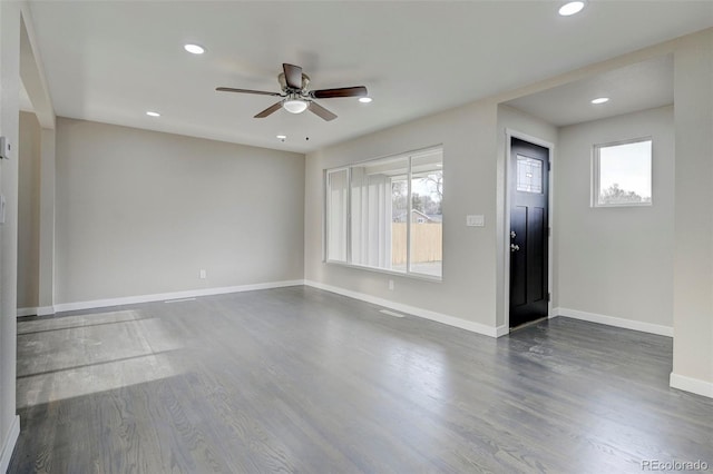 interior space featuring ceiling fan, baseboards, dark wood-style floors, and recessed lighting