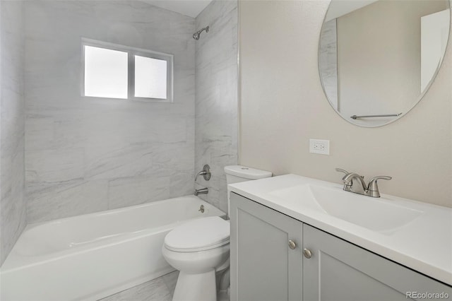 bathroom with toilet, vanity, and tub / shower combination