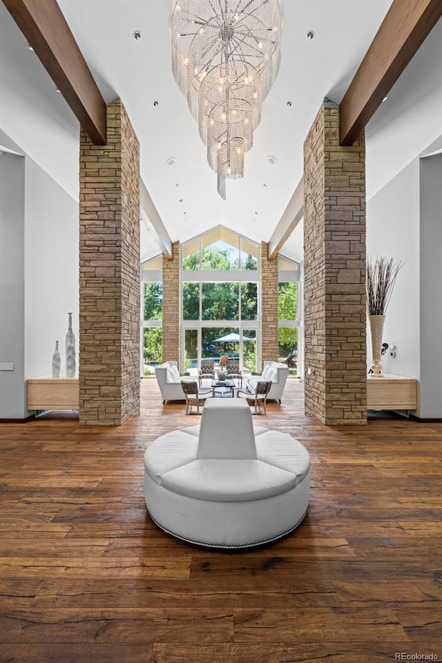 4766 S Fillmore Ct, Cherry Hills Village, CO 80113 - sitting room with beam ceiling, a chandelier, decorative columns, wood-type flooring, and high vaulted ceiling
