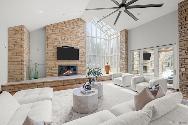 4766 S Fillmore Ct, Cherry Hills Village, CO 80113 - living room featuring high vaulted ceiling, a ceiling fan, a stone fireplace, and wood finished floors