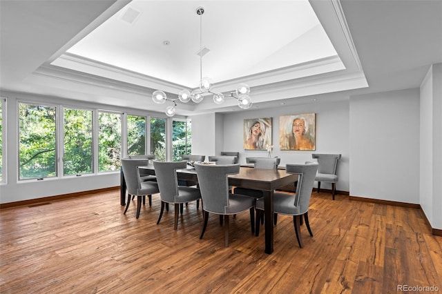 4766 S Fillmore Ct, Cherry Hills Village, CO 80113 - dining room with a raised ceiling, baseboards, wood-type flooring, a chandelier, and ornamental molding