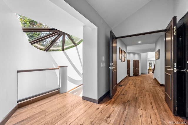 4766 S Fillmore Ct, Cherry Hills Village, CO 80113 - hallway featuring an upstairs landing, wood finished floors, vaulted ceiling, and baseboards