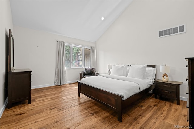 4766 S Fillmore Ct, Cherry Hills Village, CO 80113 - bedroom with high vaulted ceiling, light wood-style flooring, and baseboards