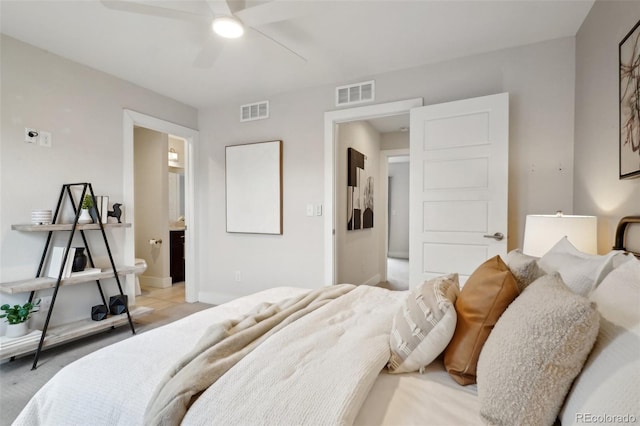 bedroom with ceiling fan and connected bathroom