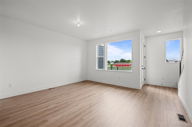 2736 W 68th Ave, Denver, CO 80221 - spare room featuring light wood-style flooring, plenty of natural light, and baseboards