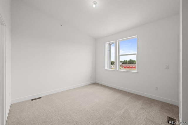 2736 W 68th Ave, Denver, CO 80221 - empty room with lofted ceiling, light colored carpet, and baseboards