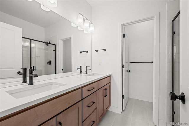 2736 W 68th Ave, Denver, CO 80221 - bathroom featuring double vanity, a stall shower, and tile patterned floors