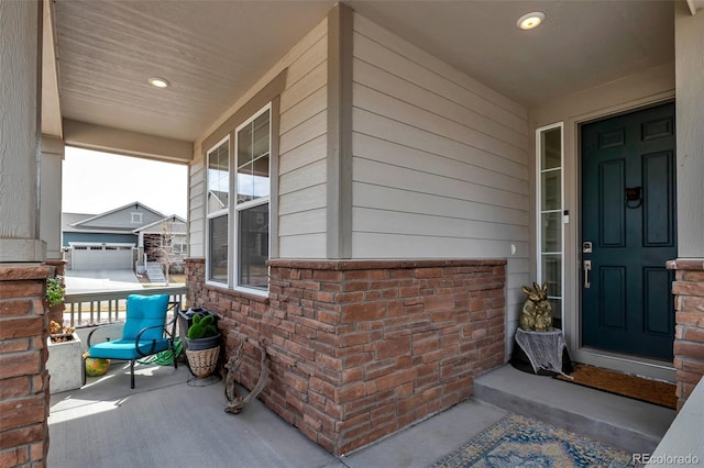 view of exterior entry with covered porch