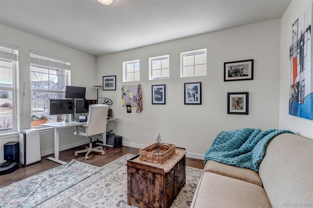 office area with wood finished floors and baseboards