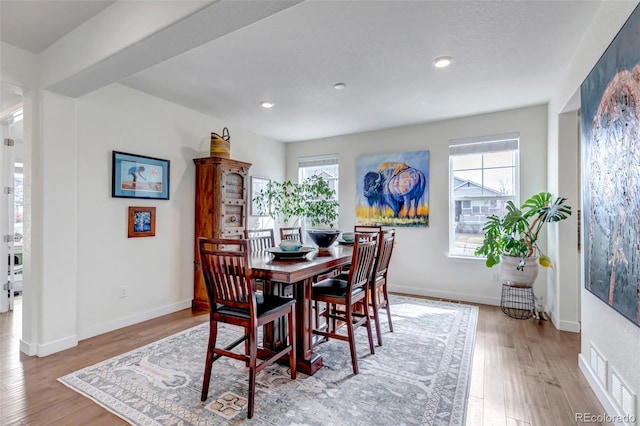 dining area featuring plenty of natural light, wood finished floors, recessed lighting, and baseboards