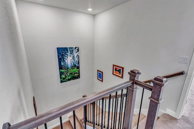 staircase with carpet flooring and baseboards